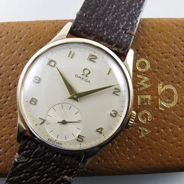 Gold Omega Ref. 920 vintage wristwatch, hallmarked 1954