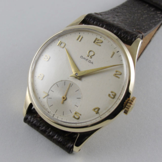 Gold Omega Ref. 920 vintage wristwatch, hallmarked 1954